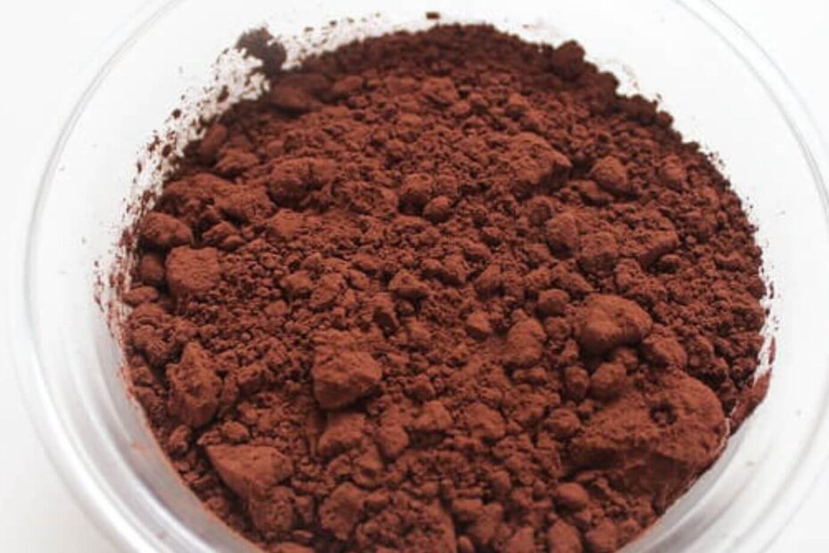 A close-up of a bowl of brown powder Description automatically generated