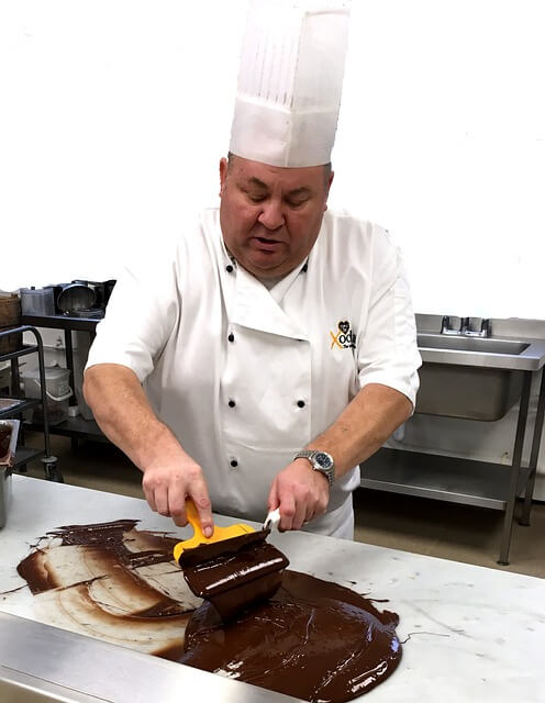 A person in a chef's hatDescription automatically generated