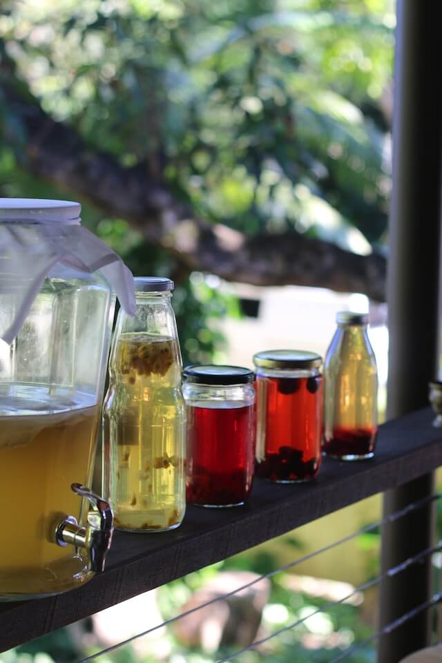 A row of jars of liquidDescription automatically generated