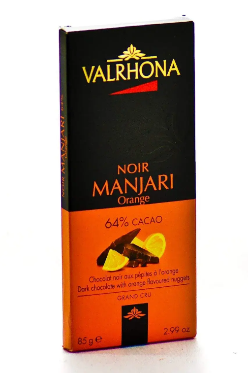 A chocolate bar with orange and black text

Description automatically generated