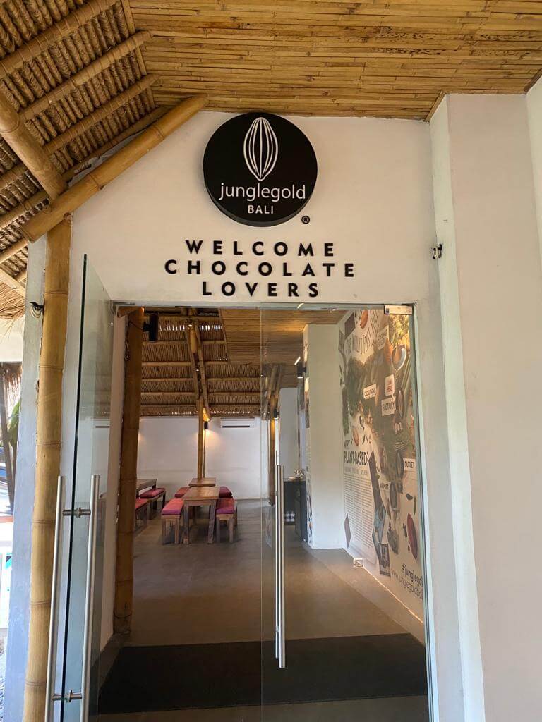 A glass door with a sign on it

Description automatically generated