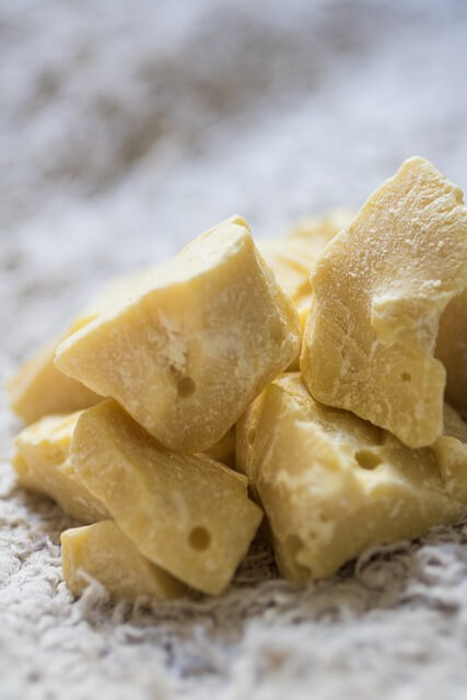 A pile of yellow pieces of foodDescription automatically generated