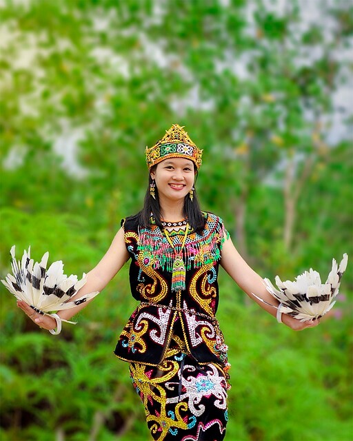 A person in a traditional garmentDescription automatically generated