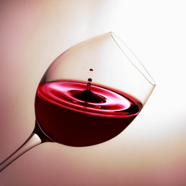 A glass of red wineDescription automatically generated