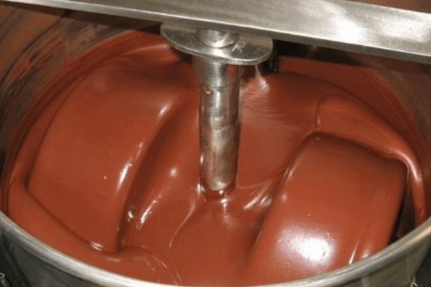 A machine with a mixing machineDescription automatically generated with medium confidence