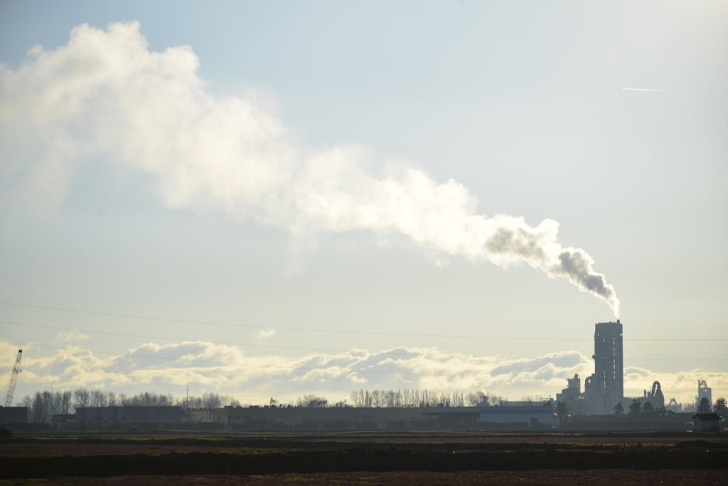 A factory with smoke coming out of it